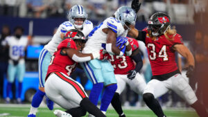 Tampa Bay Buccaneers linebacker Josiah Trotter (45) stops Dallas Cowboys running back Javonte Williams (33) in the first half of an NFL football game in Arlington, Texas on Thursday, Oct. 8, 2026. (Julio Cortez/AP)