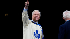 Former Toronto Maple Leafs player Darryl Sittler, points to the fans during a ceremony celebrating the 50th anniversary of his 10-point game prior to NHL action against the Buffalo Sabres in Toronto on Tuesday, Jan. 27, 2026. (Frank Gunn/CP)