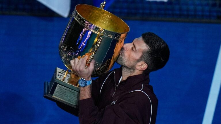 Novak Djokovic, of Serbia, kisses the trophy after winning the men's singles final match against Alex De Minaur, of Australia at the China Open tennis tournament in Beijing, Tuesday, Oct. 6, 2026. (Andy Wong/AP Photo)