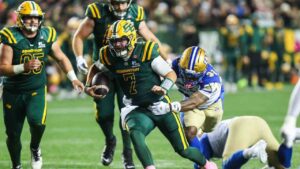 Edmonton Elks' quarterback Cody Fajardo (7) is tackled by Winnipeg Blue Bombers' Michael Griffin II (32) during first half CFL football action in Edmonton on Friday, Oct. 16, 2026. (Codie McLachlan/CP)
