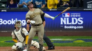 San Diego Padres' Ty France watches his ball hit a cable near the roof of American Family Field during the ninth inning of Game 1 of a National League Divisional baseball playoff series Sunday, Oct. 4, 2026, in Milwaukee. (Chris Carlson/AP Photo)
