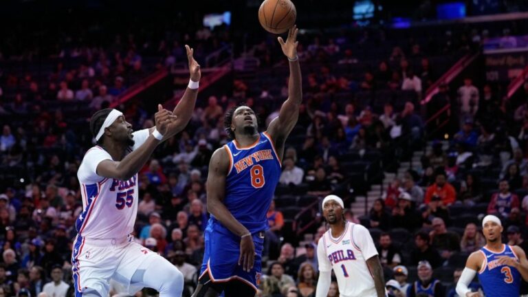 New York Knicks' OG Anunoby (8) goes up for a shot against Philadelphia 76ers' Ariel Hukporti (55) during the first half of a pre-season NBA basketball game Monday, Oct. 5, 2026, in Philadelphia. (Matt Slocum/AP)