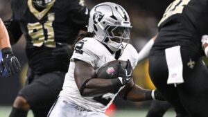 Las Vegas Raiders running back Ashton Jeanty (2) runs the ball during the first half of an NFL football game against the New Orleans Saints in New Orleans, Sunday, Sept. 27, 2026. (Ella Hall/AP)