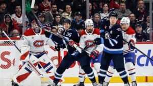 Winnipeg Jets' Vladislav Namestnikov (7) tips the puck towards Montreal Canadiens goaltender Samuel Montembeault (35) during first period NHL action in Winnipeg, Wednesday, Feb. 4, 2026. (John Woods/CP)