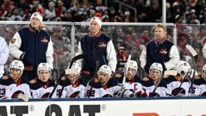 Winnipeg Jets' head coach Scott Arniel, top centre, watches the action against the Montreal Canadiens during first period NHL Heritage Classic action in Winnipeg. (Fred Greenslade/CP)