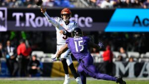Cincinnati Bengals quarterback Joe Burrow (9) throws under pressure from Baltimore Ravens linebacker Mike Green (15) during the first half of an NFL football game in Baltimore, Sunday, Oct. 25, 2026. (Nick Wass/AP)