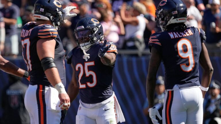 Chicago Bears running back Kyle Monangai (25) is congratulated by teammates Garrett Bradbury (67) and Jahdae Walker (9) during the first half of an NFL football game against the New York Jets Sunday, Oct. 4, 2026, in Chicago. (Nam Y. Huh/AP)
