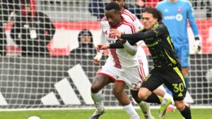 Toronto FC defender Richie Laryea, 22, chases the ball ahead of Columbus Crew midfielder Hugo Picard during second half MLS soccer action in Toronto on Saturday, March 21, 2026. (Jon Blacker/CP)