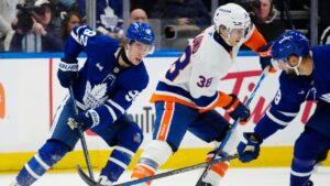 Toronto Maple Leafs' Gavin McKenna (92) chases New York Islanders' Victor Eklund (38) during first period NHL hockey action in Toronto on Saturday, Oct. 17, 2026. (Frank Gunn/THE CANADIAN PRESS)