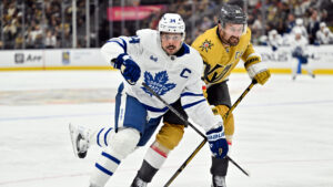 Toronto Maple Leafs' Auston Matthews (34) and Vegas Golden Knights' Mark Stone (61) battle during the third period of an NHL hockey game Thursday, Oct. 8, 2026, in Las Vegas. (David Becker/AP)