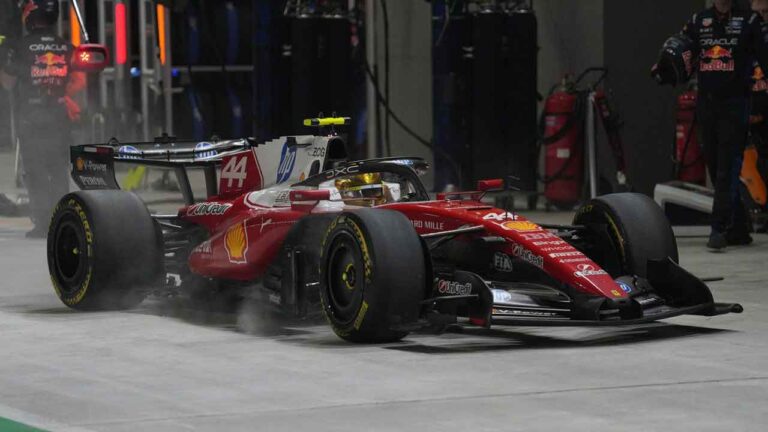 Ferrari driver Lewis Hamilton of Britain arrives for a pit service during the Singapore Formula One Grand Prix race. (Ng Han Guan/AP)