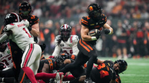 B.C. Lions' Zander Horvath (34) carries the ball for a touchdown during the first half of a CFL football game against the Ottawa Redblacks, in Vancouver, on Friday, Oct. 9, 2026. (Darryl Dyck/CP)