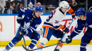 Toronto Maple Leafs' Gavin McKenna (92) chases New York Islanders' Victor Eklund (38) during first period NHL hockey action in Toronto on Saturday, Oct. 17, 2026. (Frank Gunn/CP)