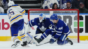 Buffalo Sabres' Owen Power (25) scores on Toronto Maple Leafs goaltender Sergei Bobrovsky (72) as Morgan Rielly (44) defends during overtime NHL hockey action in Toronto on Thursday, Oct. 15, 2026. (Nathan Denette/CP)