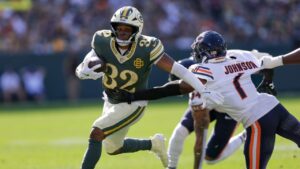 Green Bay Packers' Marshawn Lloyd runs past Chicago Bears' Jaylon Johnson during the first half of an NFL football game in Green Bay, Wis., Sunday, Oct. 11, 2026. (Matt Ludtke/AP)