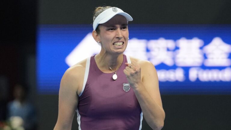 Elise Mertens, of Belgium, celebrates after defeating Iga Swiatek, of Poland in the quarterfinals of the women's singles match at the China Open tennis tournament in Beijing, Friday, Oct. 9, 2026. (Andy Wong/AP Photo)