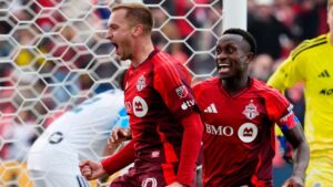 Toronto FC Djordje Mihailovic (10) celebrates his game-winning goal with teammate Richie Laryea (22) as CF Montreal Sebastian Breza (1) looks on during second half MLS soccer action, in Toronto, Saturday, Oct. 10, 2026. (Frank Gunn/CP)