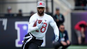 AFC running back Joe Mixon (28), of the Houston Texans, carries the ball during the flag football event at the NFL Pro Bowl Games on Sunday, February 2, 2025, in Orlando, Fla. (Doug Benc/AP Images for NFL)