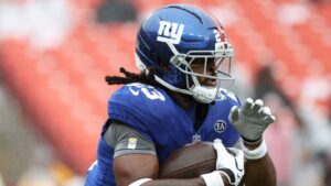 New York Giants running back Najee Harris (23) runs with the ball during an NFL football game against the Washington Commanders, Sunday, Oct. 11, 2026, in Landover, Md. (Daniel Kucin Jr./AP)