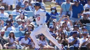 Los Angeles Dodgers' Shohei Ohtani runs after hitting a single during the first inning of Game 1 of a National League Division Series baseball game against the Atlanta Braves Saturday, Oct. 3, 2026, in Los Angeles. (Jae C. Hong/AP Photo)