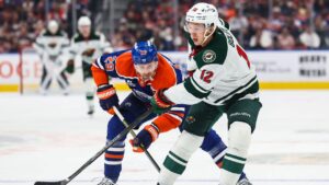 Edmonton Oilers' Leon Draisaitl (29) skates against Minnesota Wild's Matt Boldy (12) during first period NHL hockey action in Edmonton on Tuesday, Oct. 20, 2026. (Codie McLachlan/THE CANAIDAN PRESS)