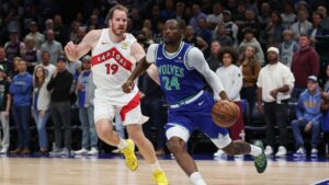 Minnesota Timberwolves forward Jonathan Kuminga (24) drives to the basket while Toronto Raptors center Jakob Poeltl (19) defends during the first half of an NBA basketball game, Sunday, Oct. 25, 2026, in Minneapolis. (Bailey Hillesheim/AP Photo)