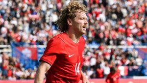 Canada's Jacob Shaffelburg (14) celebrates after scoring against Peru during first half International friendly soccer action in Montreal, on Saturday, Oct. 3, 2026. (Graham Hughes/THE CANADIAN PRESS)
