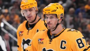 Pittsburgh Penguins' Sidney Crosby (87) and Evgeni Malkin (71) prepare for a face-off during the second period of an NHL hockey game against the Dallas Stars in Pittsburgh, Saturday, Oct. 10, 2026. (Gene J. Puskar/AP)