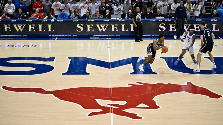Duke guard Caleb Foster (1) brings the ball up court past the SMU mid court logo during an NCAA college basketball game, Saturday, Jan 4, 2025, in Dallas. (Jerome Miron/AP Photo)
