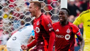 Toronto FC Djordje Mihailovic (10) celebrates his game-winning goal with teammate Richie Laryea (22) as CF Montreal Sebastian Breza (1) looks on during second half MLS soccer action, in Toronto, Saturday, Oct. 10, 2026. (Frank Gunn/THE CANADIAN PRESS)