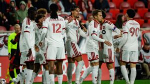 Toronto FC players celebrate a goal by Josh Sargent, hidden at left, during an MLS soccer match against the New York Red Bulls, Saturday, Oct. 17, 2026, in Harrison, N.J. (Eduardo Munoz Alvarez/AP Photo)