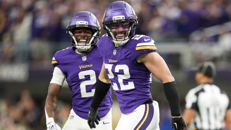 Minnesota Vikings safety Harrison Smith (22) celebrates with cornerback Isaiah Rodgers (2) after intercepting a pass against the Indianapolis Colts during the second half of an NFL football game. (Ellen Schmidt/AP)