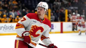 Calgary Flames centre Connor Zary (47) plays against the Nashville Predators during the third period of an NHL hockey game Tuesday, Dec. 2, 2025, in Nashville, Tenn. (Mark Humphrey/AP)